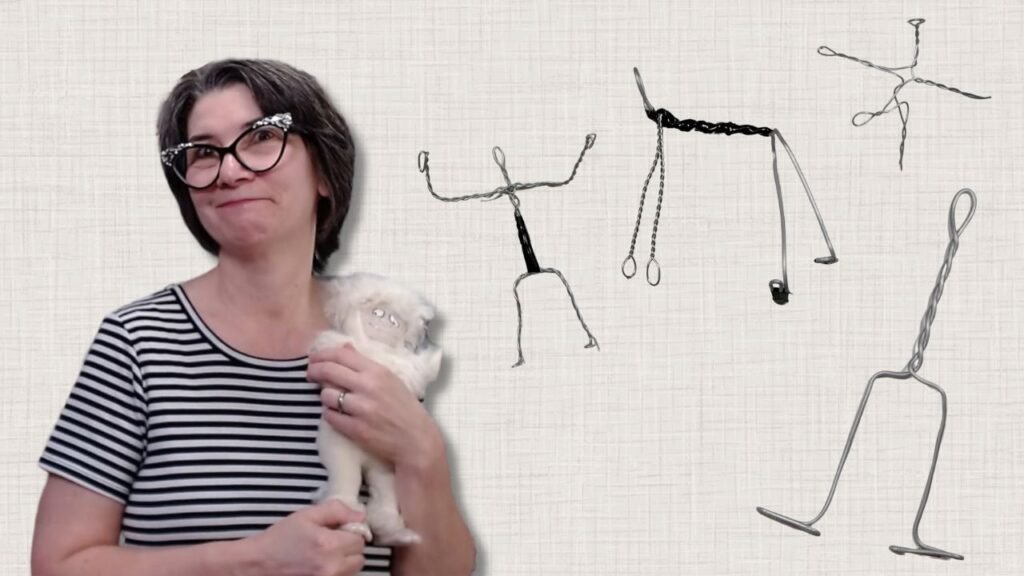 several shapes of wire armatures are shown with Luci holding a poseable yeti doll