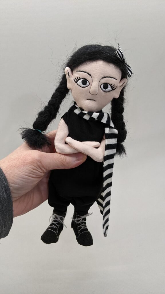 goth girl doll in hand to show sizing